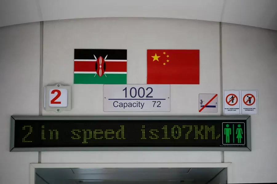 The Kenyan and Chinese national flags hang on the wall of an SGR train traveling from Nairobi to Mombasa, Kenya, on October 22, 2019.