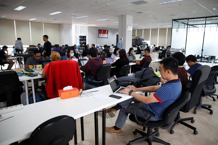 Employees work at the office of Modalku, an Indonesian financial technology (fintech) startup, in Jakarta, Indonesia on January 29, 2018.