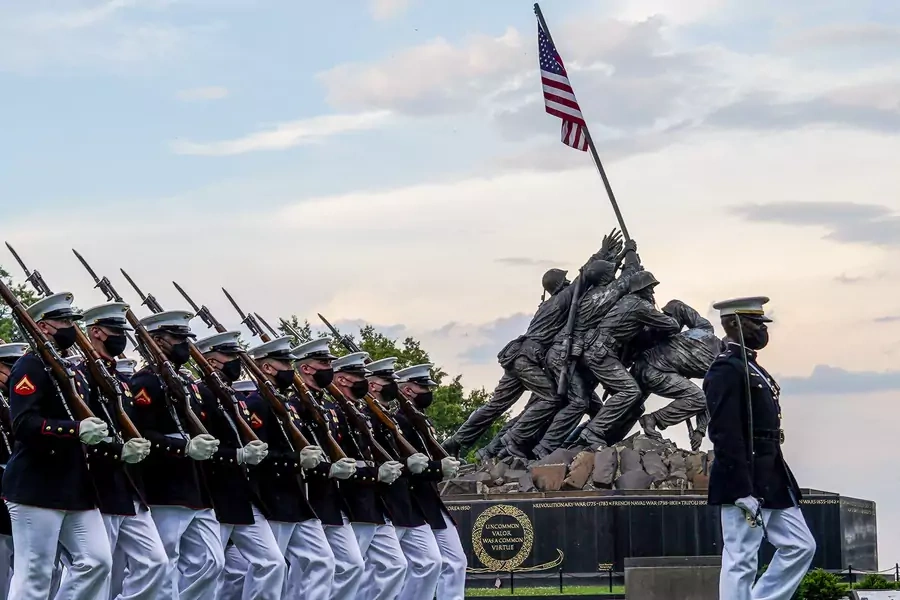 Marines part of the Silent Drill Platoon march in front of the Marine Corps War Memorial in Arlington, Virginia on June 9. 2021. 