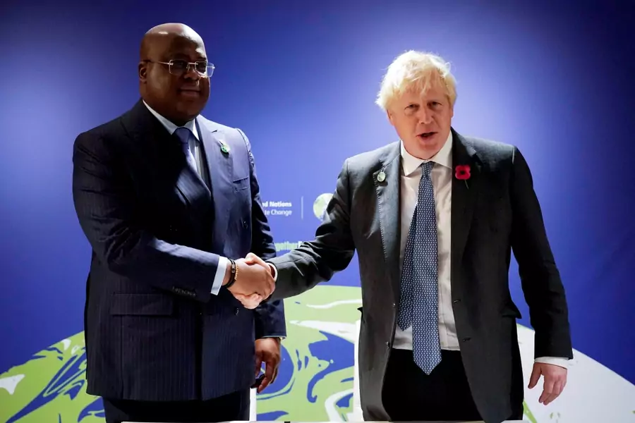 British Prime Minister Boris Johnson shakes hands with Democratic Republic of Congo's president, Felix Tshisekedi, during the UN Climate Change Conference (COP26) in Glasgow, Scotland, United Kingdom on November 2, 2021.