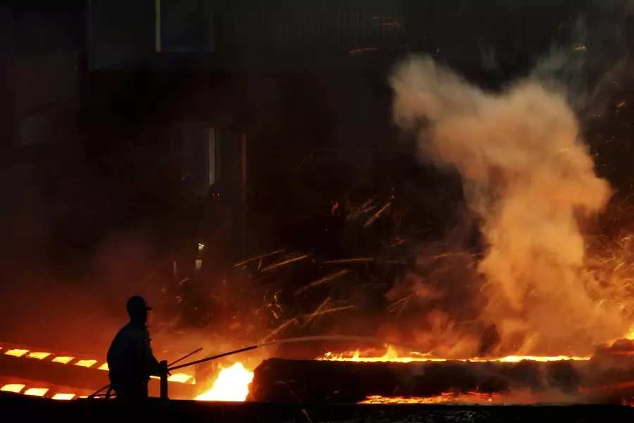 A laborer works inside a steel factory in Dalian, China on October 11, 2013