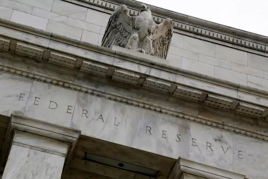 An eagle tops the U.S. Federal Reserve building's facade in Washington D.C. on July 31, 2013. 