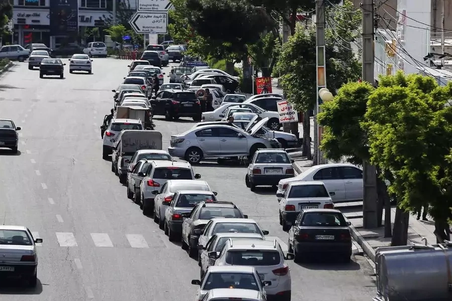 Cars queueing in front of a gas station during an Israeli cyberattack on Iran's country's fuel subsidy network.