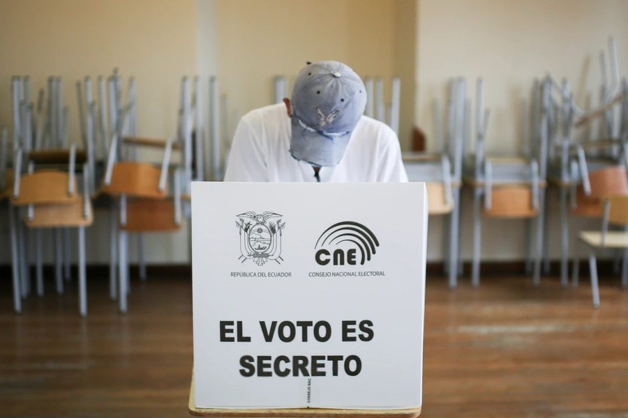 A voter fills out a ballot at a polling station during Ecuador’s second round of presidential elections on April 11, 2021. 