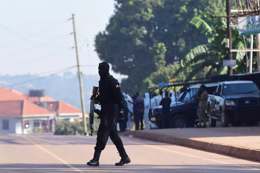 Ugandan police members secure the scene of an explosion in Komamboga, a suburb on the northern outskirts of Kampala, Uganda on October 24, 2021.