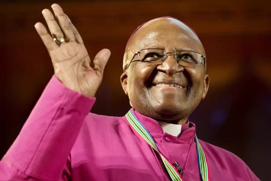 Archbishop Emeritus Desmond Tutu waves after receiving the Templeton Prize in London on May 21, 2013.