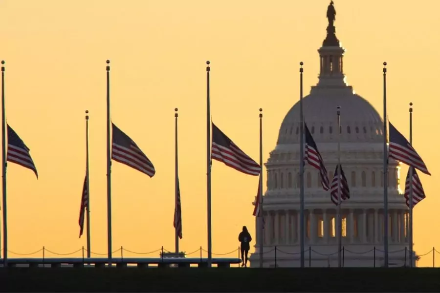 American flags surrounding the Washington Monument fly at half-staff on October 19, 2021, in honor of Colin Powell. 