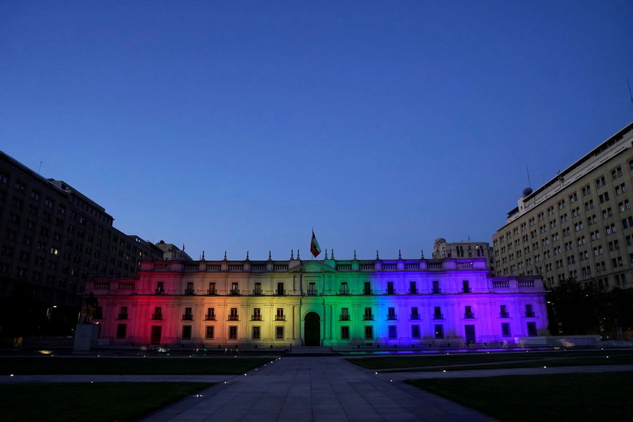 Chile's government palace is illuminated with the LGBT flag colours after the Senate approved a same-sex marriage bill in Santiago, Chile, December 7, 2021. 