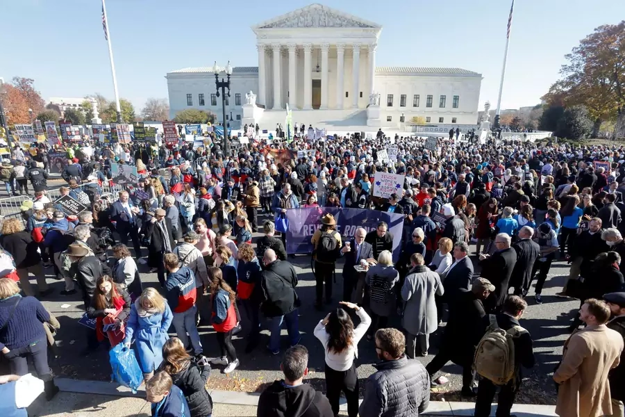 People gather outside the Supreme Court building on the day of arguments in the Mississippi abortion rights case Dobbs v. Jackson Women's Health, in Washington, U.S., December 1, 2021.