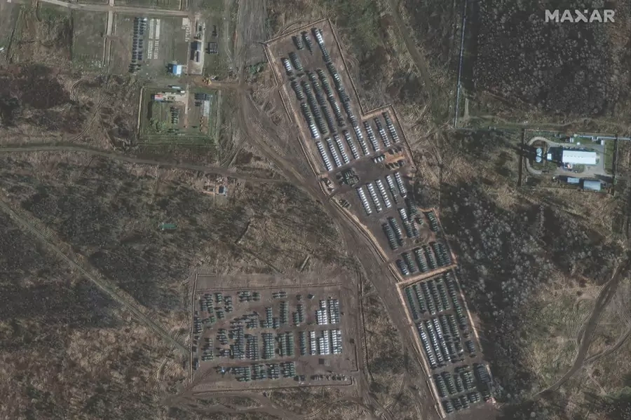 Armored units and support vehicles of the Russian army parked near the border between Russia and Ukraine. The United States has threatened sanctions if the Russians cross into Ukrainian territory.