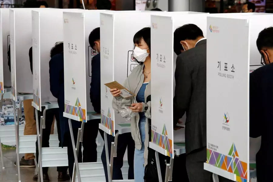 Voters cast absentee ballots for the April 2020 parliamentary election at a polling station in Seoul.