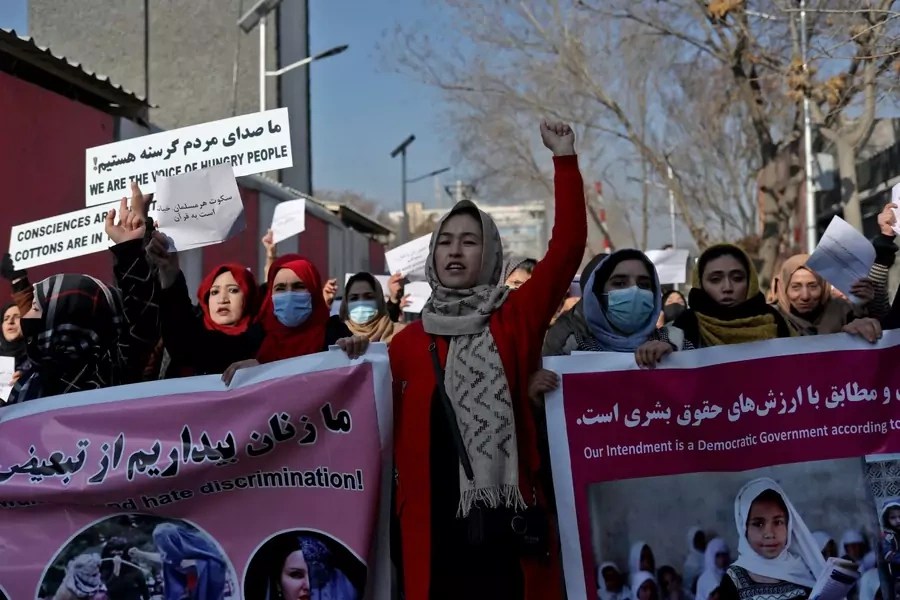 Afghan women shout slogans during a rally to protest against what the protesters say is Taliban restrictions on women, in Kabul, Afghanistan on December 28, 2021.