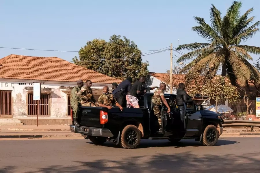 Armed soldiers move on the main artery of the capital after heavy gunfire around the presidential palace in Bissau, Guinea-Bissau on February 1, 2022.