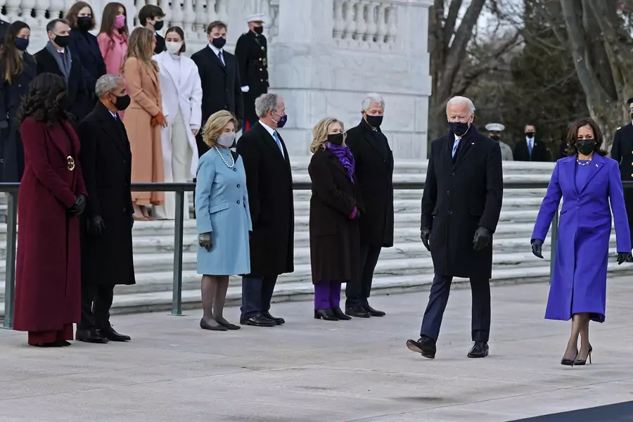 President Joe Biden and Vice President Kamala Harris arrive at Arlington National Cemetery's Tomb of the Unknown Soldier on January 20, 2021, as former Presidents Barack Obama, George W. Bush, and Bill Clinton look on with their wives. 