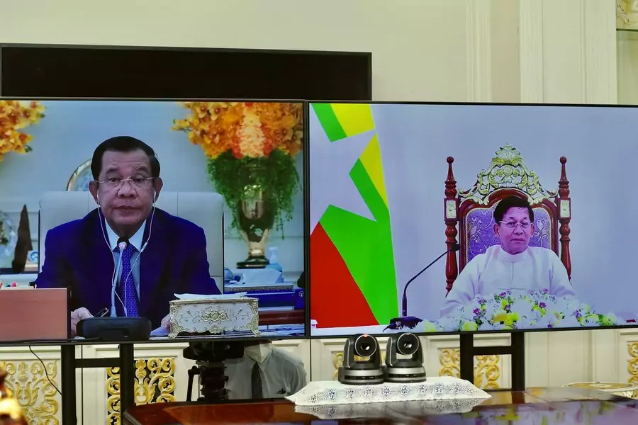 Screens show Cambodia's Prime Minister Hun Sen and Commander-in-Chief of Myanmar's armed forces, Senior General Min Aung Hlaing, attending a video call at Peace Palace in Phnom Penh, Cambodia, on January 26, 2022.