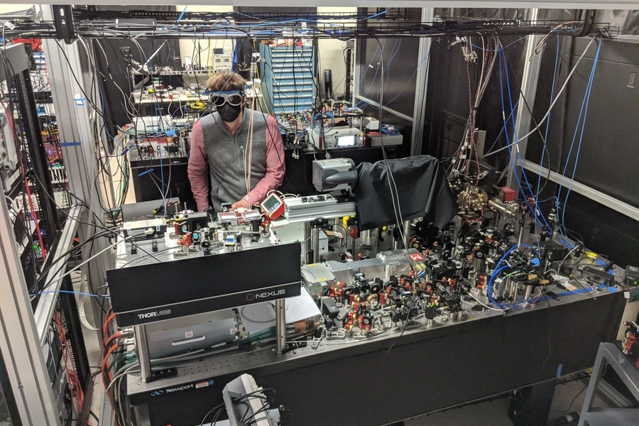 Quantum computer startup QuEra Computing's 256-qubit machine and Florian Huber, one of the team of scientist that built the machine are shown in this picture taken in Boston, Massachusetts, U.S., on February 18, 2021.
