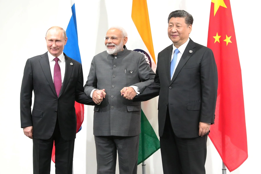 Russia's President Vladimir Putin, India's Prime Minister Narendra Modi and China’s President Xi Jinping pose for a picture during a meeting at the G20 summit in Osaka, Japan on June 28, 2019.