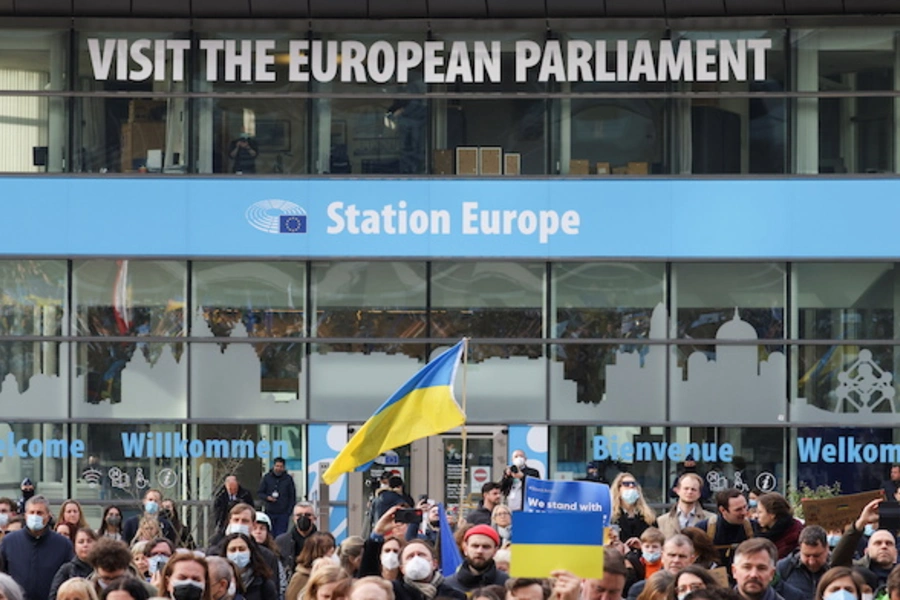 People carry flags and banners at a protest of members of the European Parliament and citizens, including Ukrainian living in Belgium, in support of Ukraine and against the war, amid Russia's invasion of Ukraine, in Brussels, Belgium on March 1, 2022.