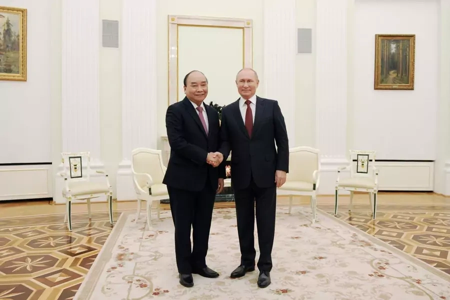 Russia's President Vladimir Putin shakes hands with Vietnam's President Nguyen Xuan Phuc during a meeting in Moscow, Russia November 30, 2021. Sputnik/Mikhail Klimentyev/Kremlin via REUTERS