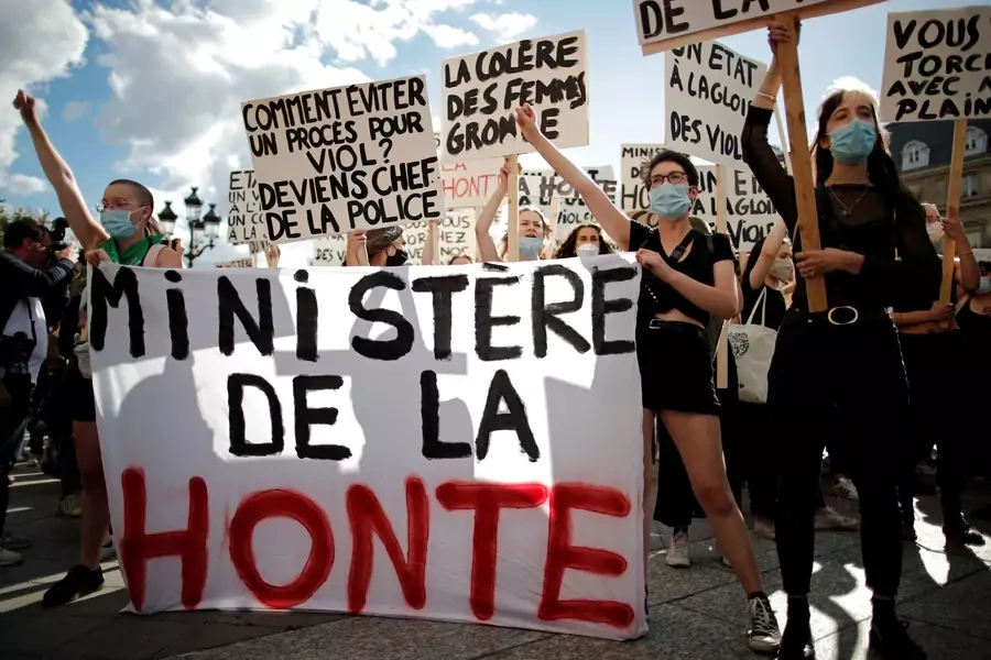 Feminist activists hold a banner reading "ministry of shame" during a protest against the appointments of French Interior Minister Gerald Darmanin in the new French government, in front of the city hall in Paris, France on July 10, 2020.