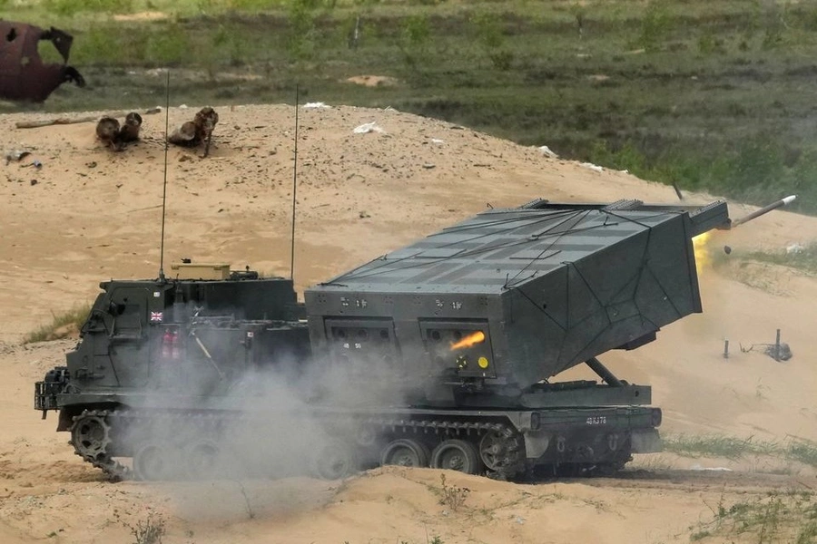 A British M270 multiple rocket launch system fires during an exercise in Latvia in 2022.