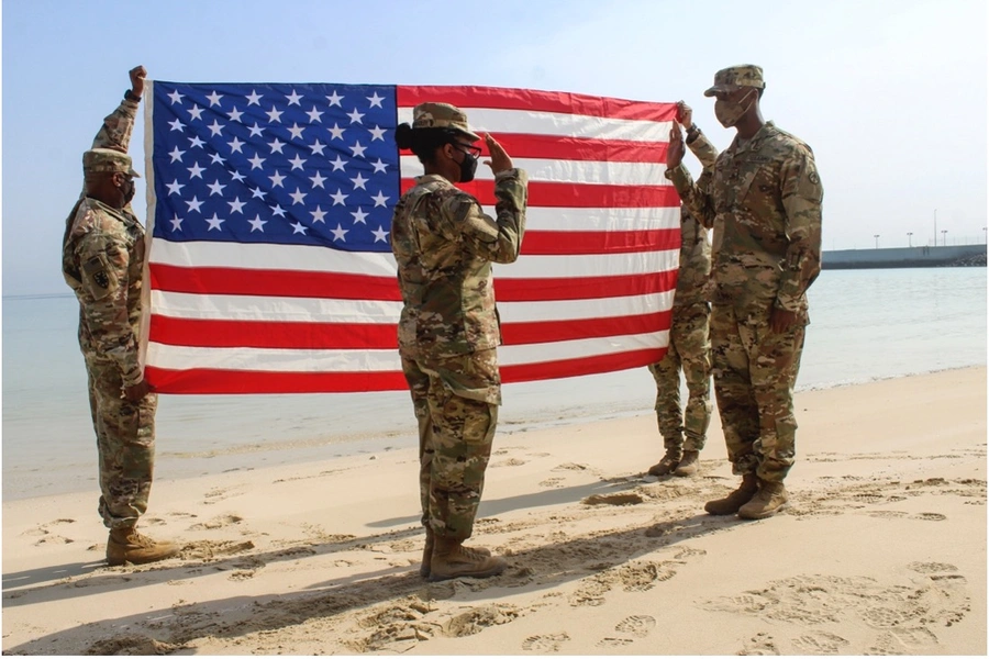 Army Captain Tiara Tompkins-Bradley reaffirms Sergeant Ricky N. Paige’s oath of enlistment at Kuwait Naval Base on February 4, 2021.