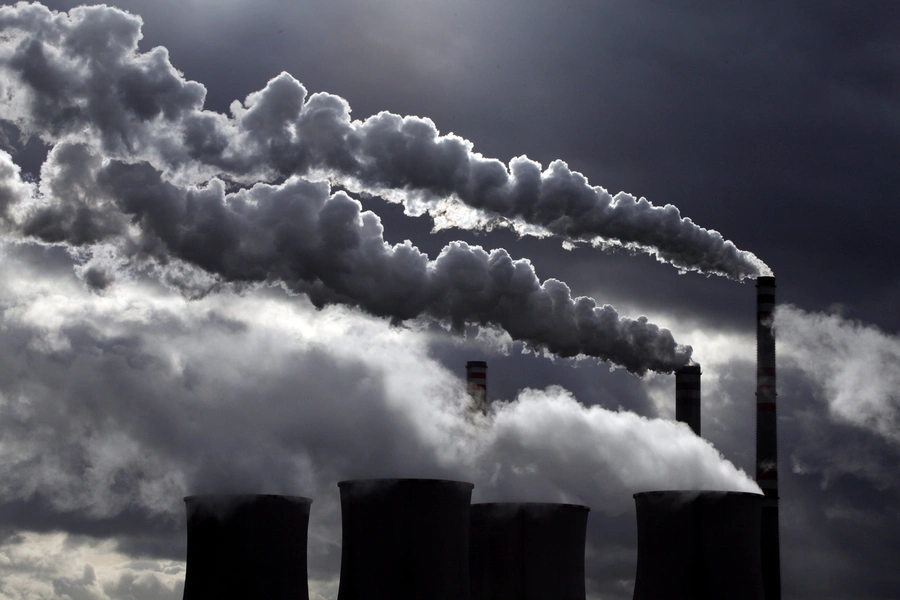 Cooling towers and smoke stacks at a power plant. 