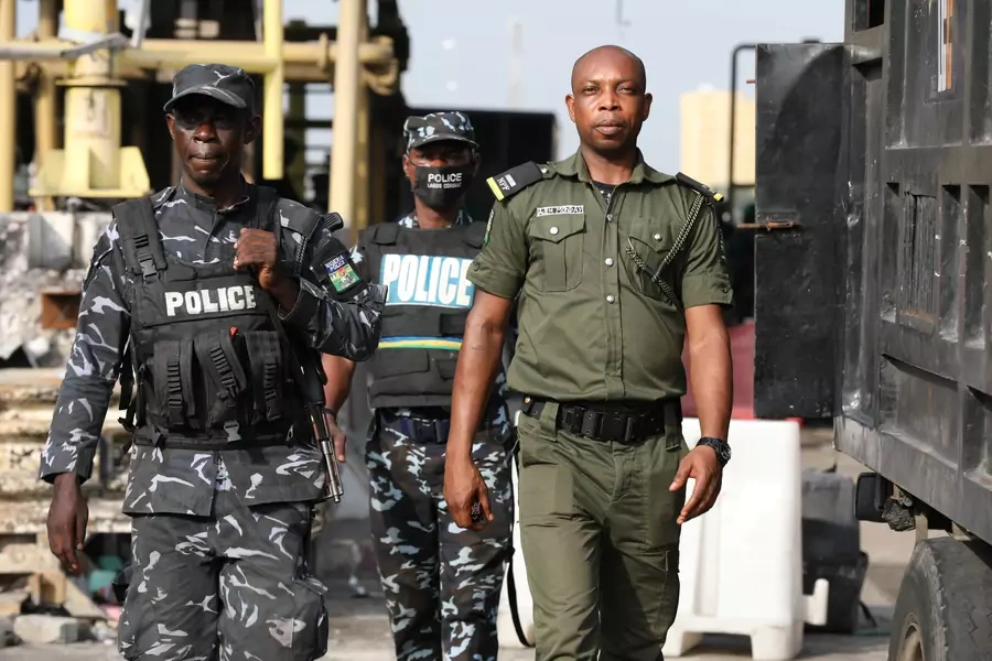 Police officers are seen during a protest against the reopening of the Lekki Toll Gate in Lagos on February 13, 2021.