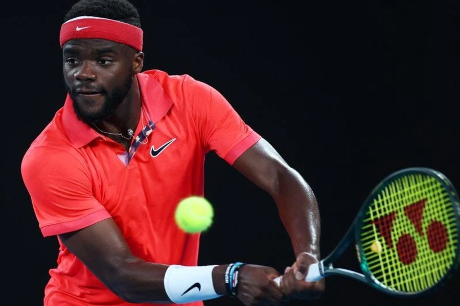 Frances Tiafoe hits a volley during a match at the Australian Open in January 2020.