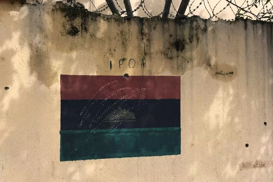 A wall at the family home of Indigenous People of Biafra (IPOB) separatist leader Nnamdi Kanu depicts a painted flag of the former Republic of Biafra and holes purportedly caused by bullets in Umuahia, Nigeria on September 27, 2017.