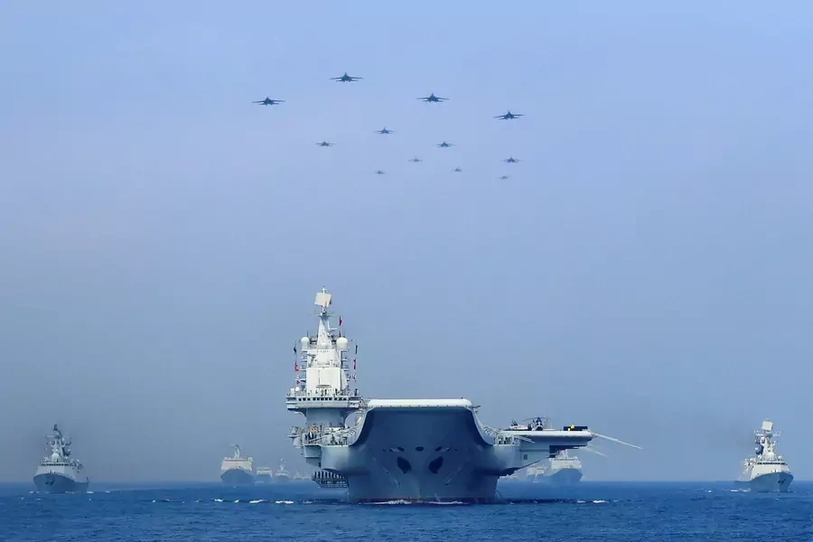 Ships from the People's Liberation Army Navy sail during 2018 live fire exercises in the Taiwan Strait.