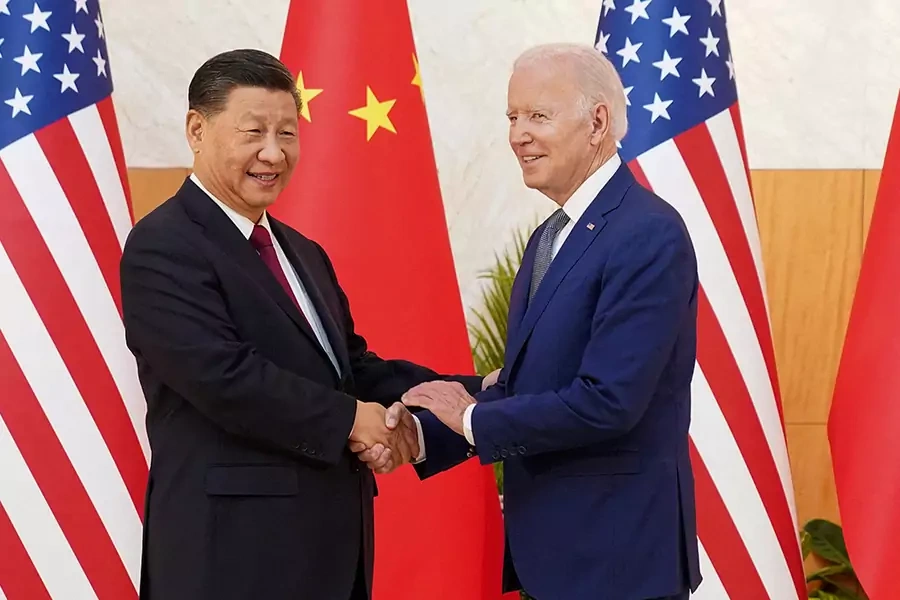 U.S. President Joe Biden shakes hands with Chinese President Xi Jinping as they meet on the sidelines of the G20 leaders' summit in Bali, Indonesia, November 14, 2022.