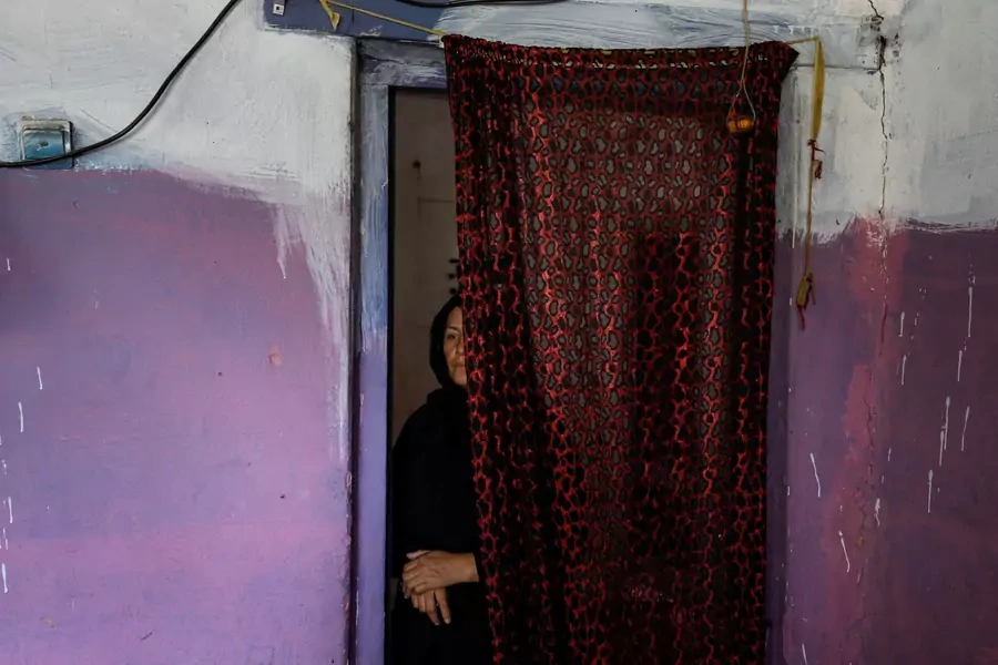 Golestan Safari, 45, poses for a photograph in her house in Kabul.