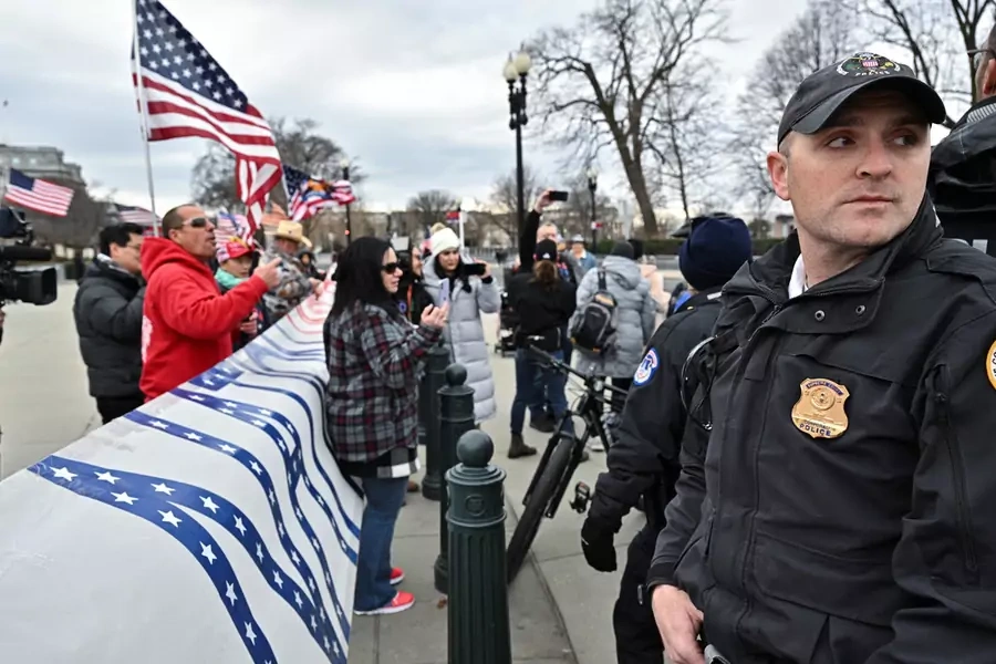 Supporters of those arrested on January 6, 2021 face off with the police near the Capitol in Washington