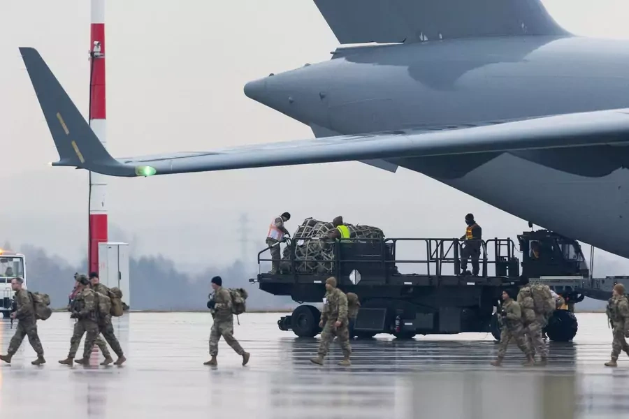 U.S. soldiers unload equipment from a plane at Rzeszów Airport in Poland in February 2022.