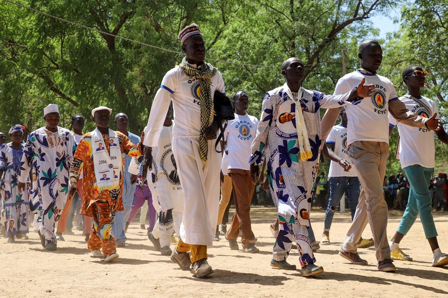 Militants of Cameroonian President Paul Biya's ruling party march during the National Youth Day celebrations in Yagoua, Cameroon on February 11, 2023