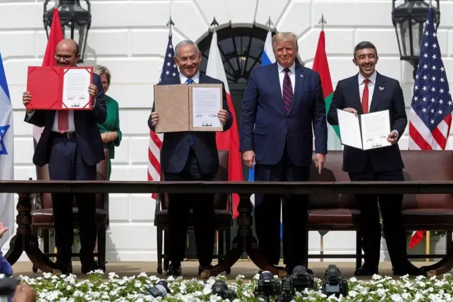 Israel's Prime Minister Benjamin Netanyahu, United Arab Emirates (UAE) Foreign Minister Abdullah bin Zayed, and Bahrain’s Foreign Minister Abdullatif Al Zayani stand at the signing ceremony for the Abraham Accords at the White House in September 2020.