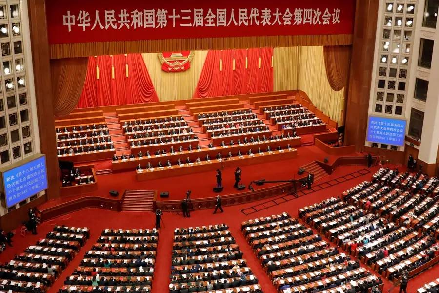 Chinese leaders and delegates attend the closing session of the National People's Congress in Beijing in March 2021
