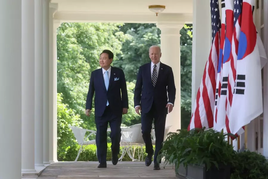 U.S. President Joe Biden and South Korea's President Yoon Suk Yeol exit the Oval Office and walk up the West Wing colonnade to the Rose Garden to hold a joint news conference at the White House on April 26, 2023.