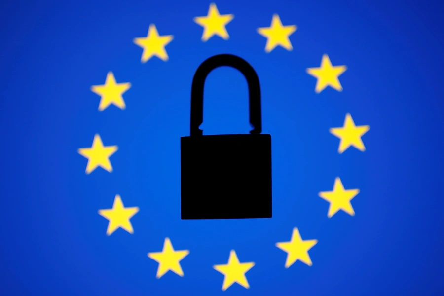 A padlock sits in the center of a European Union flag.