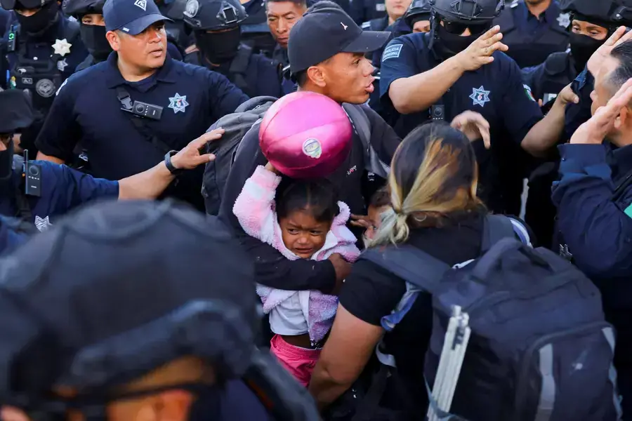 Police evict migrants from a camp in Ciudad Juarez