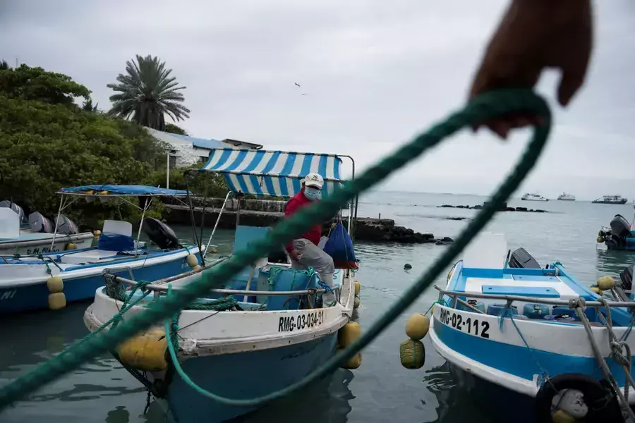 A fisherman gets off his boat after Ecuador’s government expanded the protected marine area around the Galápagos Islands, in Puerto Ayora on the island of Santa Cruz, Galápagos Islands, Ecuador January 24, 2022.