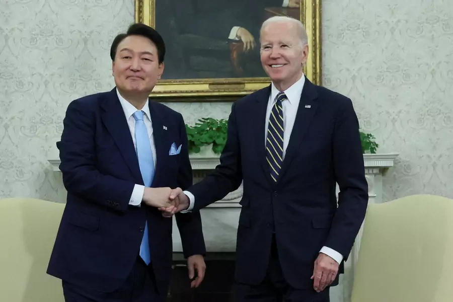 U.S. President Joe Biden and South Korean President Yoon Suk-yeol shake hands as they meet in the Oval Office of the White House on April 26, 2023.