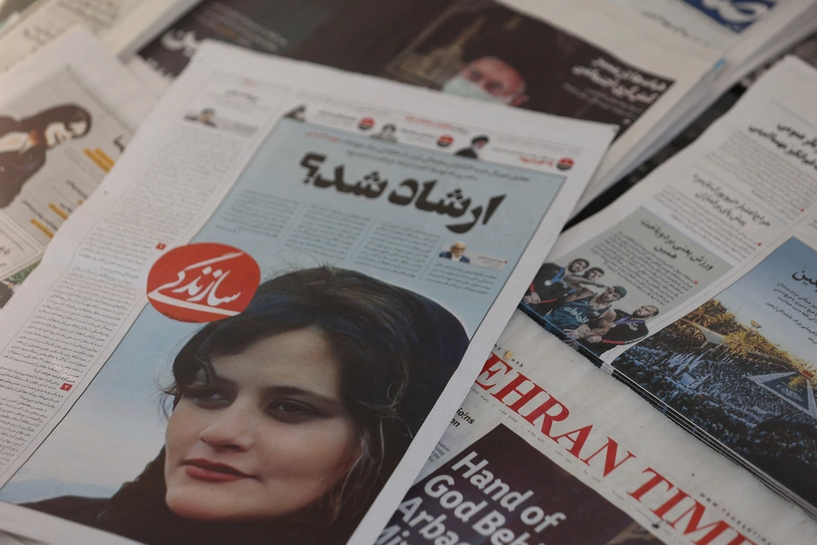 A newspaper with a cover picture of Mahsa Amini, a woman who died after being arrested by the Islamic republic's "morality police" is seen in Tehran, Iran September 18, 2022.