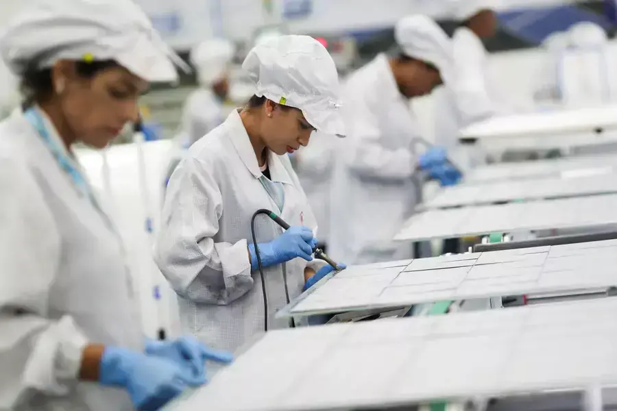 Employees work on a solar energy panel of Chinese solar equipment manufacturer BYD in Campinas, Brazil, February 13, 2020.