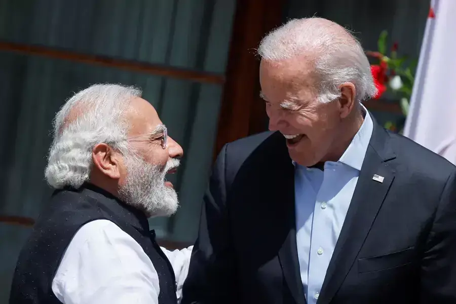 U.S. President Joe Biden and India's Prime Minister Narendra Modi laugh as they speak in front of Schloss Elmau castle in the Bavarian Alps on June 27, 2022.
