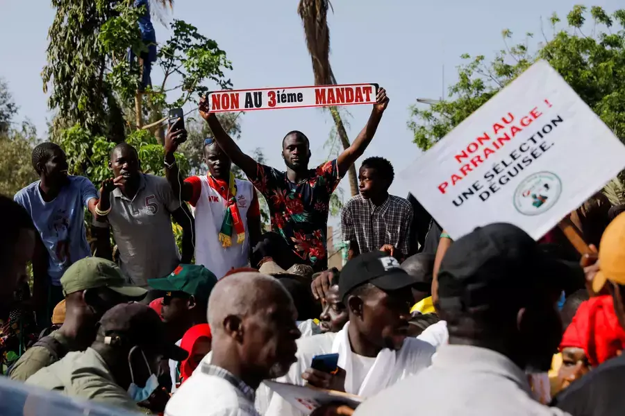 A protester holds a sign reading "no to the third term" while attending a demonstration against the possible third term ambition of President Macky Sall, in Dakar, Senegal, on May 12, 2023.