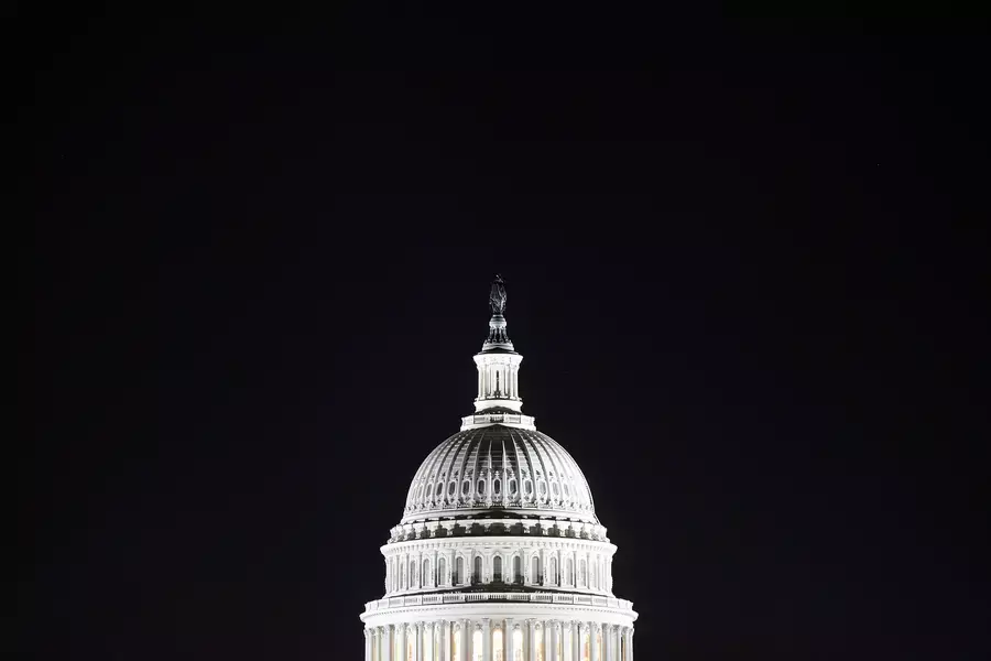 The U.S. Capitol dome in the pre-dawn darkness in Washington, DC.