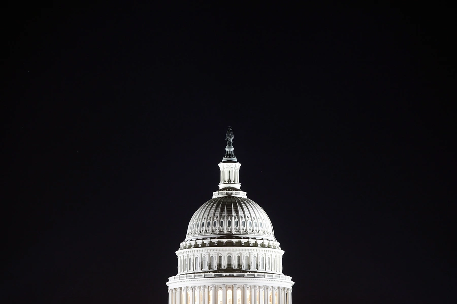 The U.S. Capitol dome in the pre-dawn darkness in Washington, DC.