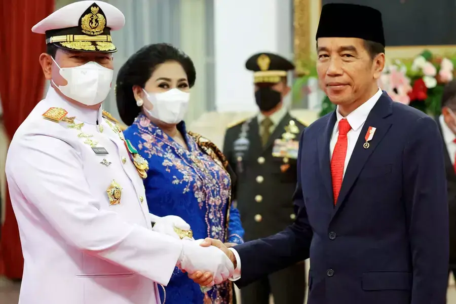 Indonesian President Joko Widodo congratulates the newly appointed Commander of the Indonesian National Armed Forces Admiral Yudo Margono, during an inauguration ceremony at the Presidential Palace in Jakarta, Indonesia, on December 19, 2022.